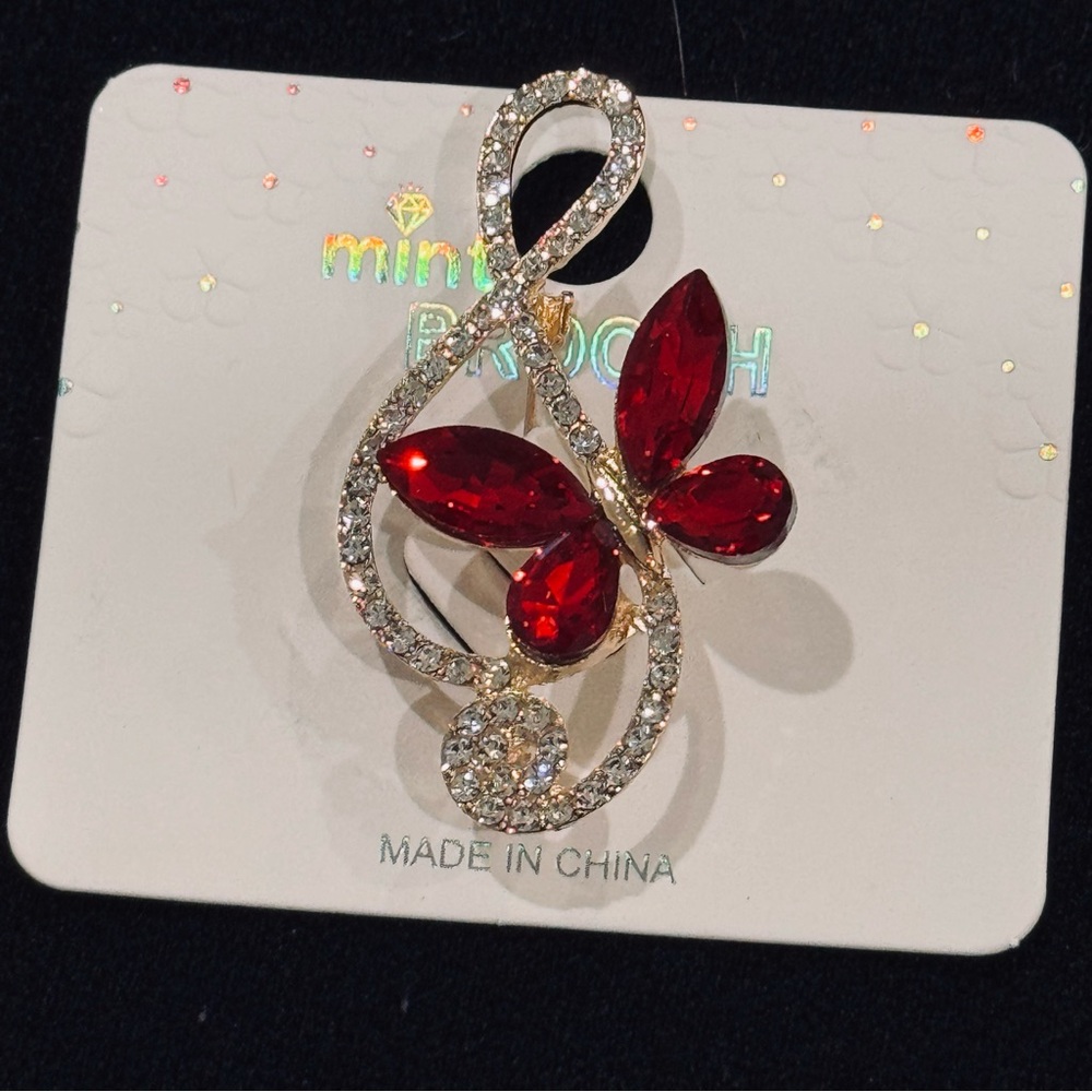 NWT Mint Gold-Tone Treble Clef Brooch with Red Crystal Butterfly Accent